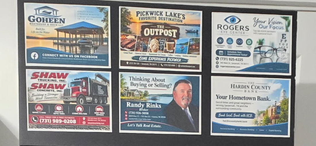 The six advertiser cards across the top of a glass board